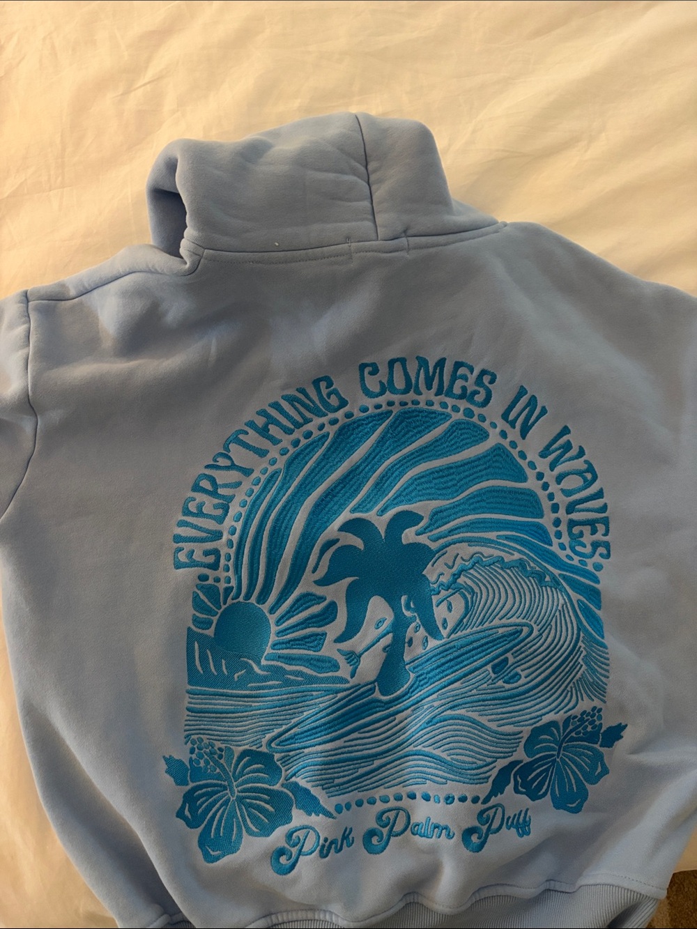 Pink Palm Duffy Light Blue Crewneck Sweatshirt with Wave Graphic